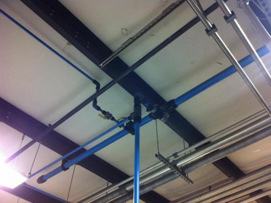The aluminum pipes are blue in color and slip fit connectors are black.