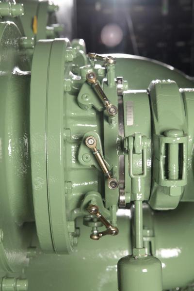 Side view of a mounted IGV showing the yoke assembly and actuator.