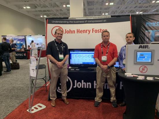 Christian Corrigan, Mark Ames and Kevin Dodd at the John Henry Foster booth